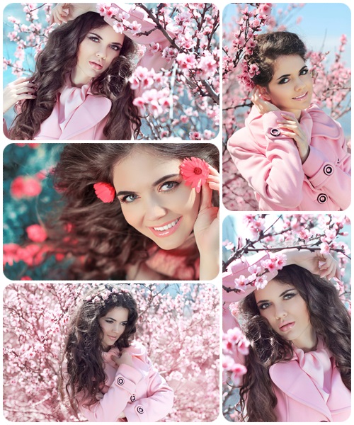 Portrait of Beautiful woman posing over Pink Spring Cherry bloss - Stock Photo